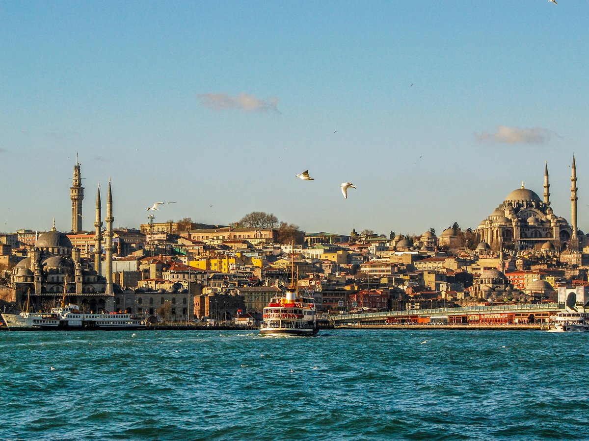 city buildings near body of water during daytime