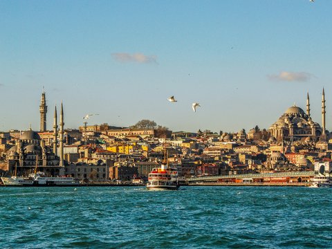 city buildings near body of water during daytime