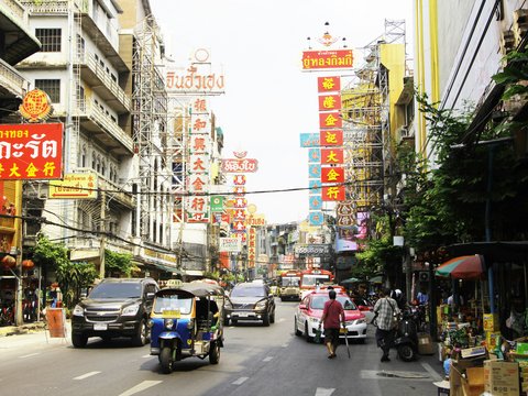 people and cars on road