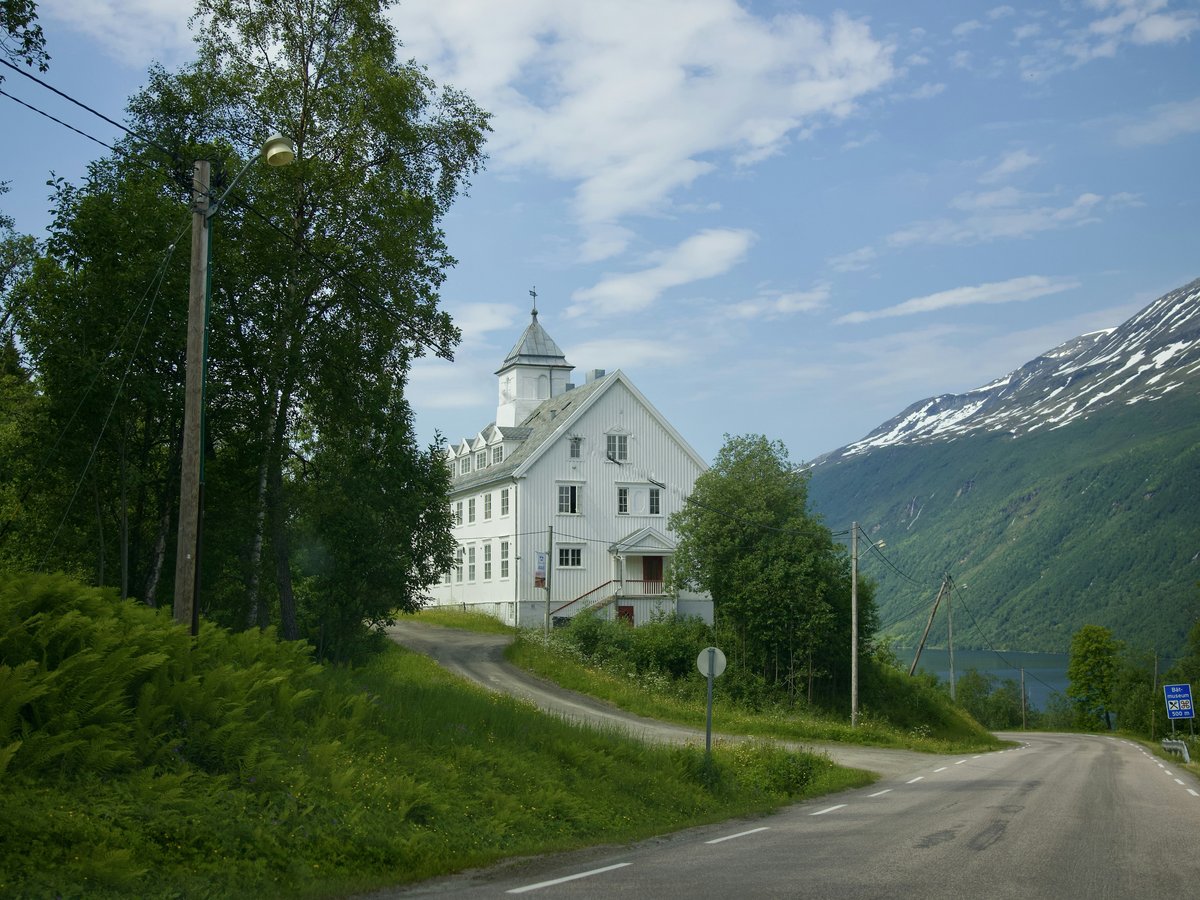 a white building on a hill