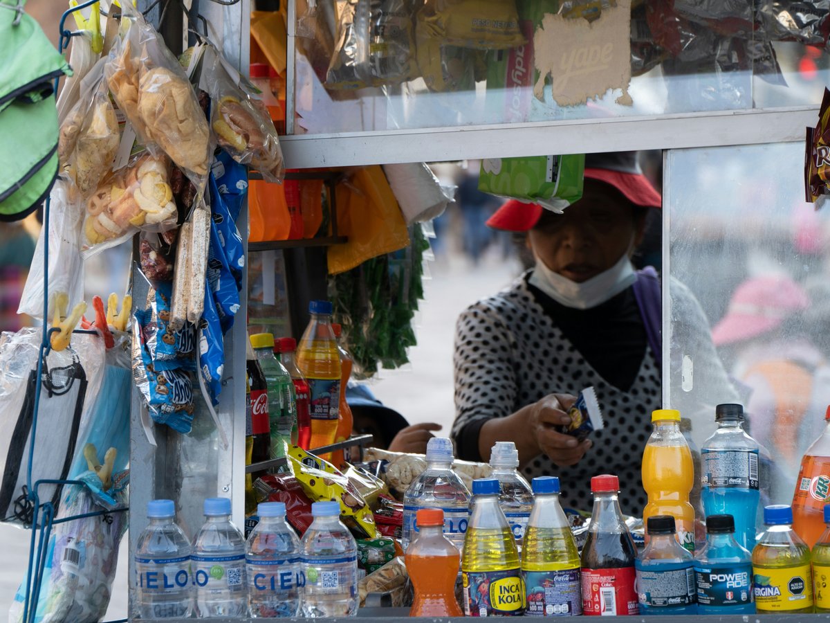 Street vendor with drinks and snacks for sale