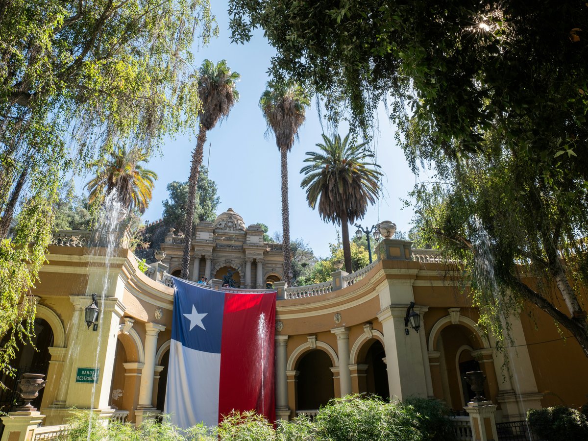 a large texas state flag hanging from the side of a building