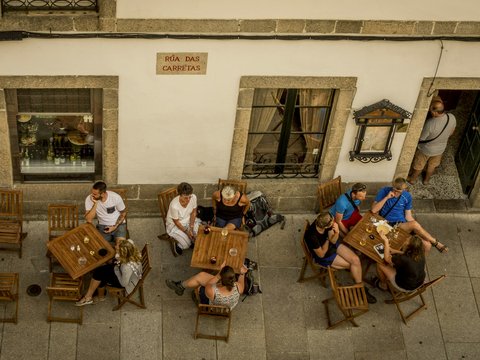group of people sitting on brown wooden chair