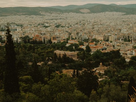 a view of a city with mountains in the background