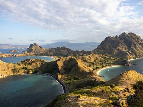 a body of water surrounded by mountains