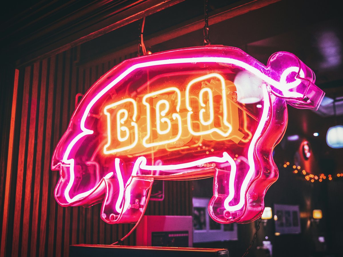a neon sign with a pig on it