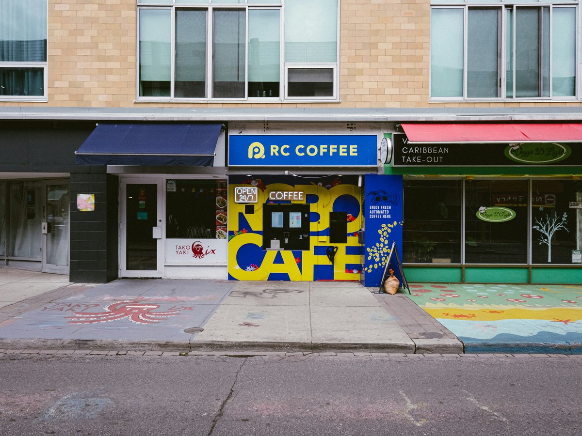 A coffee shop on the corner of a street