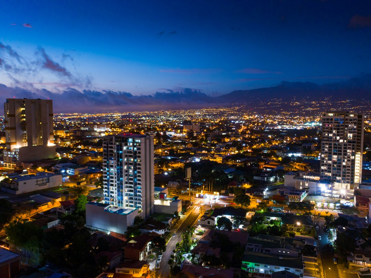 a view of a city at night from the top of a building