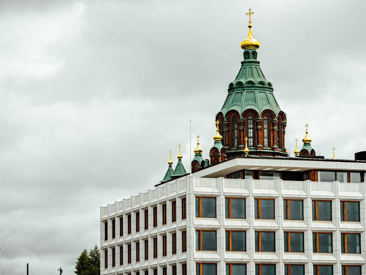 a tall building with a clock on the top of it