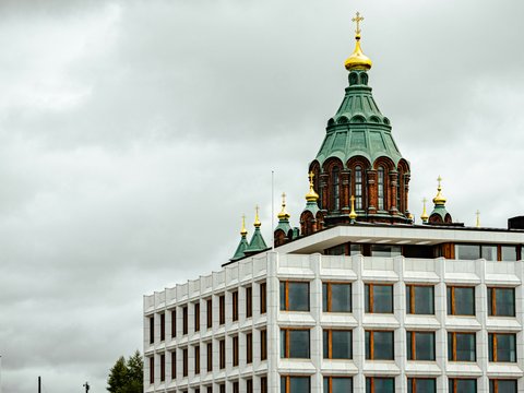 a tall building with a clock on the top of it