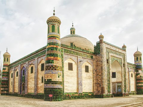 a large building with a green and white roof