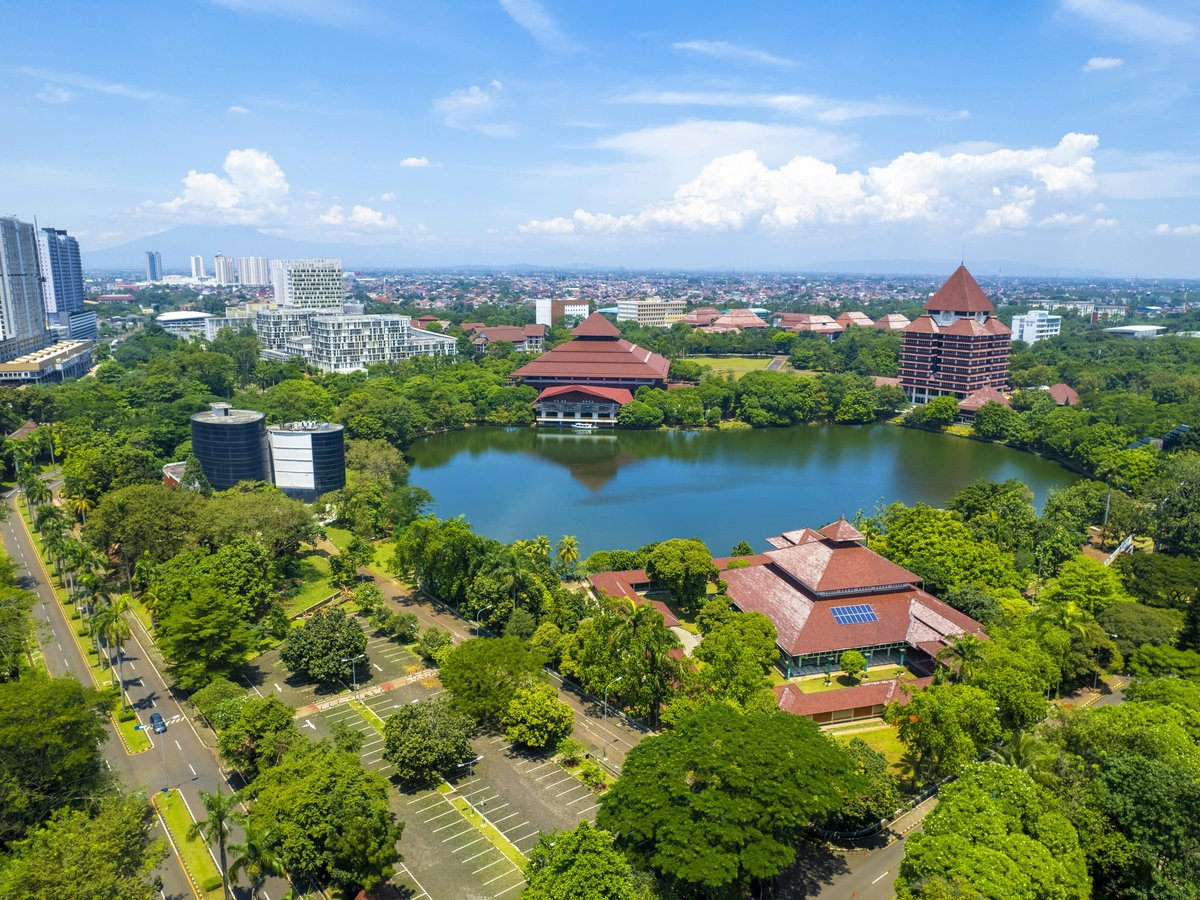 a river with buildings and trees around it