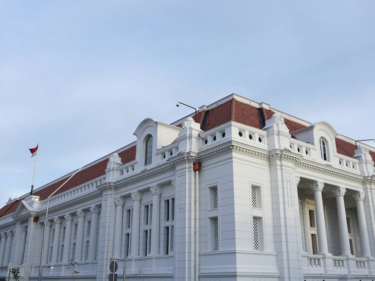 a large white building with a red roof