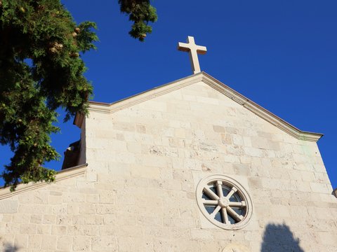 A church with a cross on the top of it