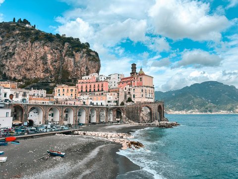 A view of a beach with a mountain in the background