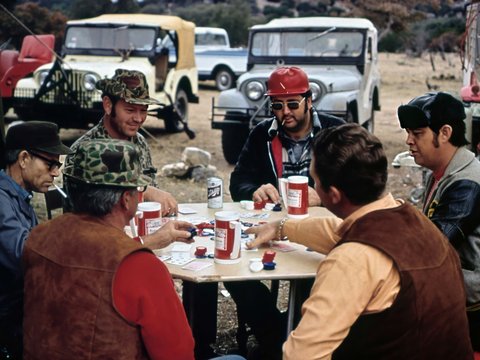 a group of men sitting around a table