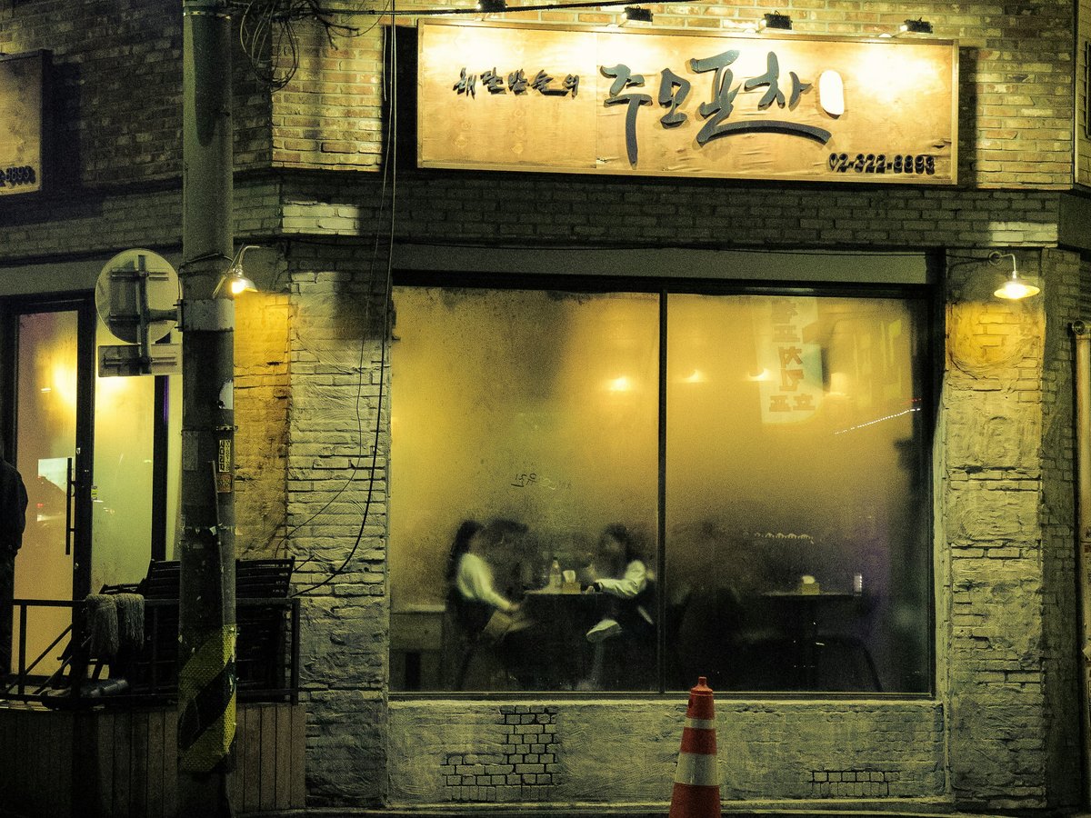 two women sitting inside fastfood
