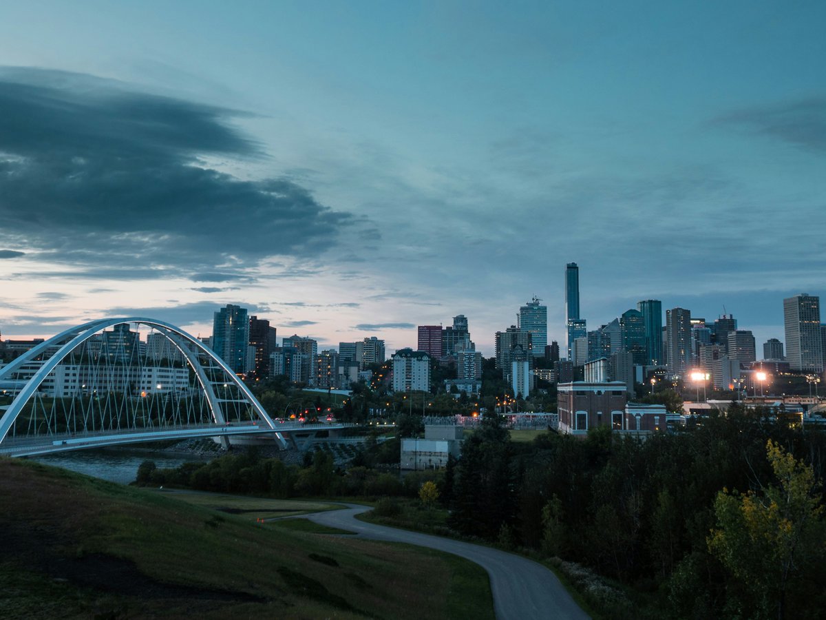 white bridge over the city during daytime