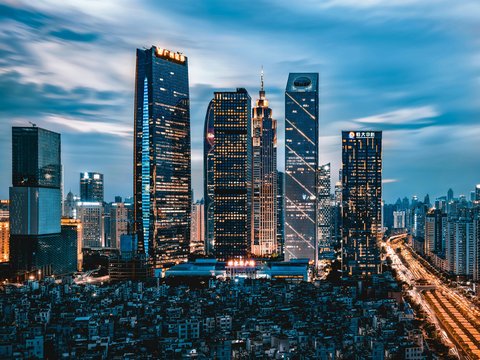 grey clouds hovering over city lights