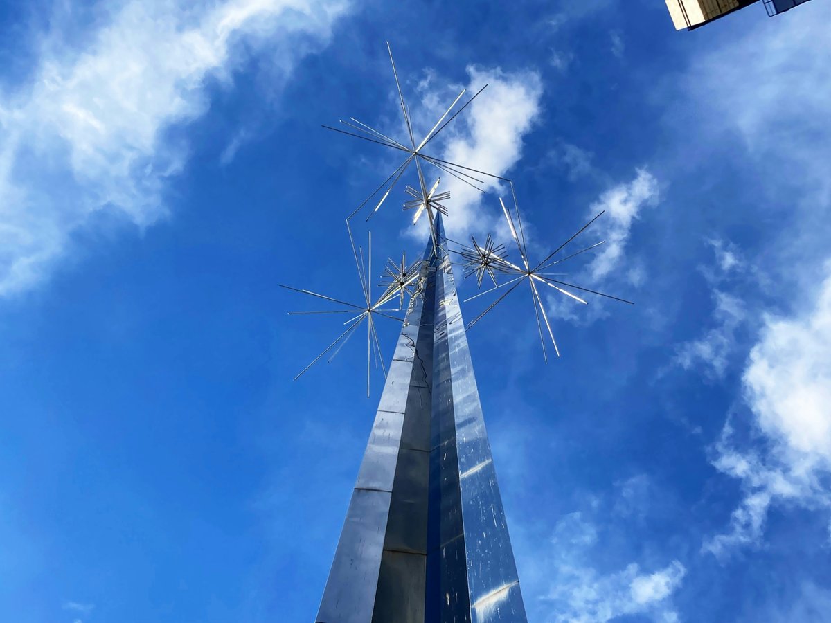 A very tall building with a sky background