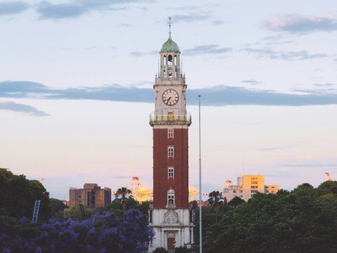 a tall tower with a clock on the top of it