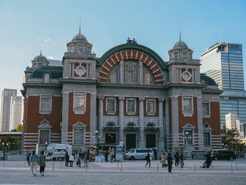 Historic building with modern skyscrapers in background