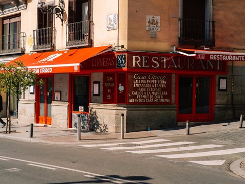 a street corner with a restaurant on the corner