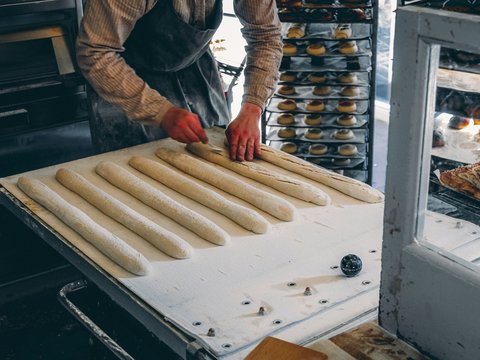 a person making a doughnut
