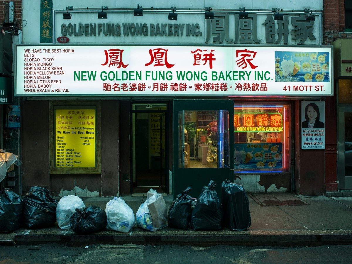 a store front with bags of food in front of it