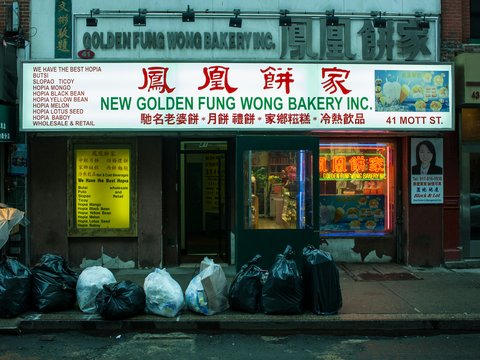 a store front with bags of food in front of it