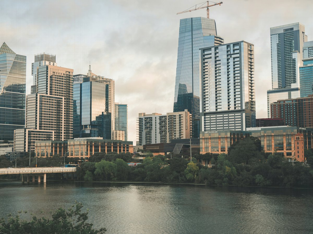 City skyline with buildings near the water.