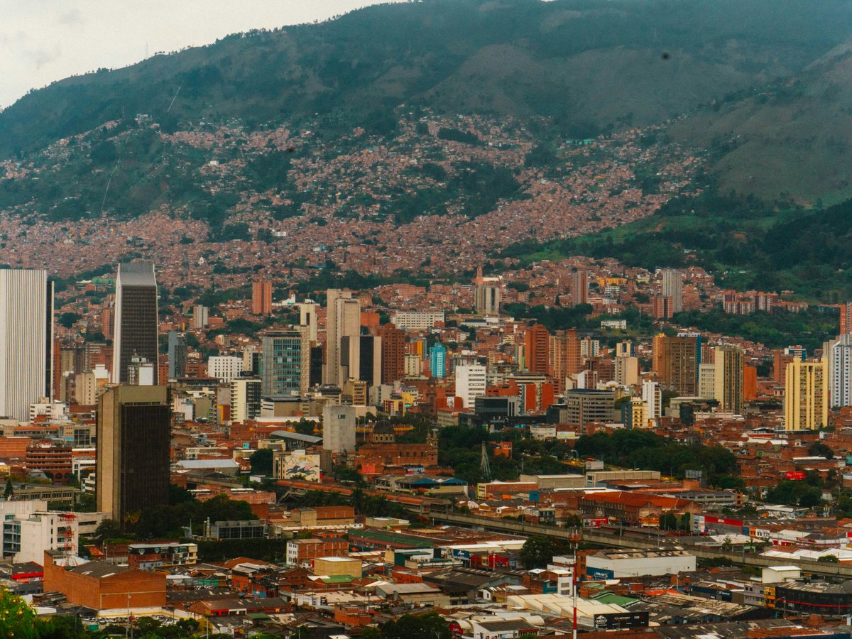 a view of a city with mountains in the background