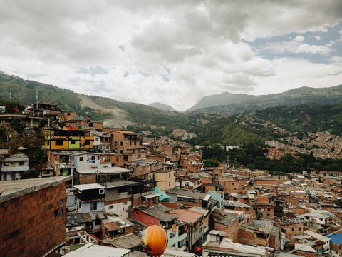 a view of a city with mountains in the background