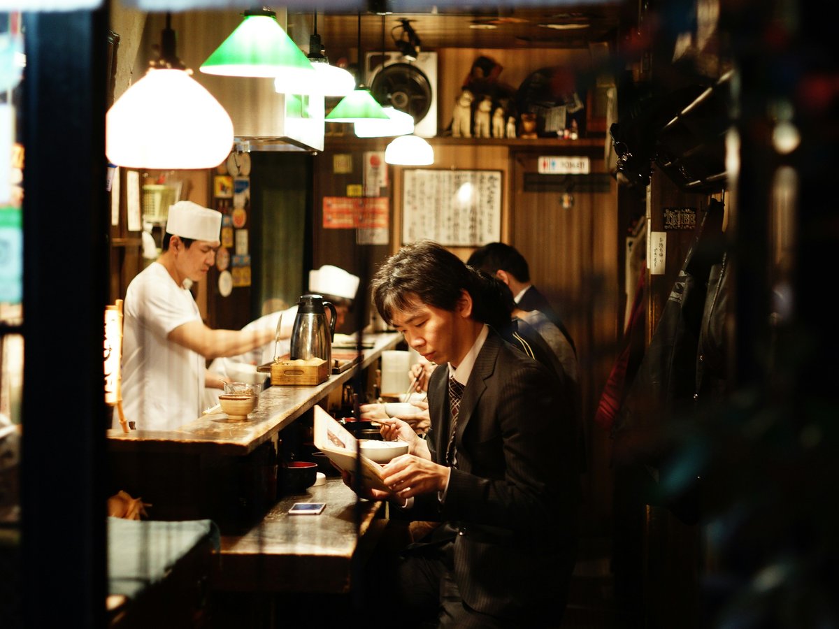 man holding menu