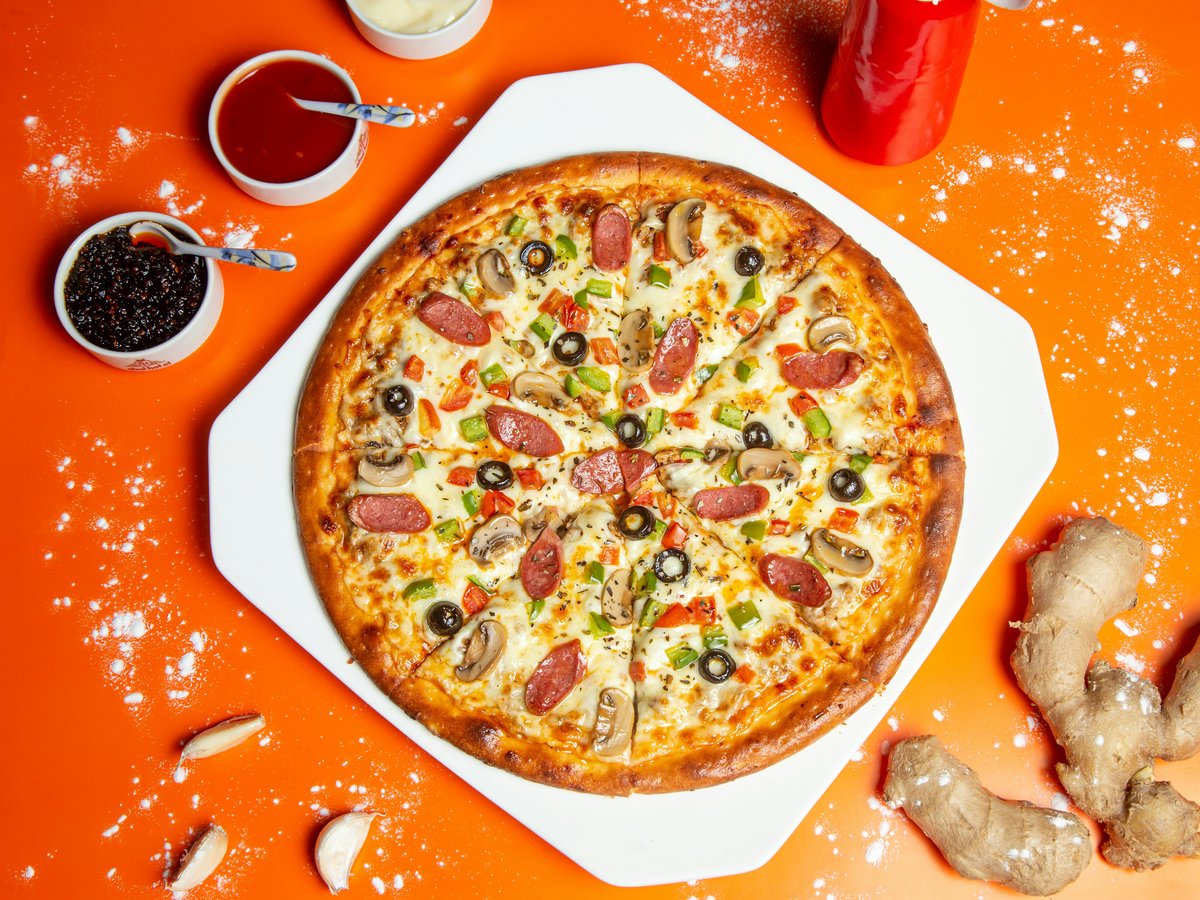 pizza with cheese and green leaf