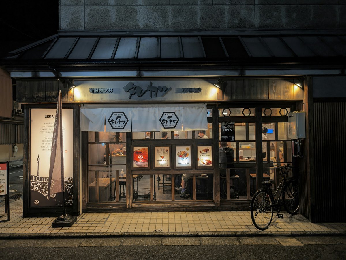 A bike is parked outside of a building