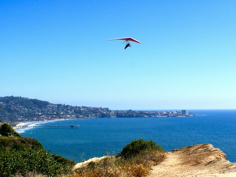 a kite flying over a body of water
