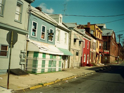 A street lined with colorful buildings.