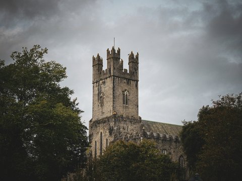 a tall tower with a clock on the top of it