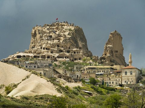 a large rock formation in the middle of a town