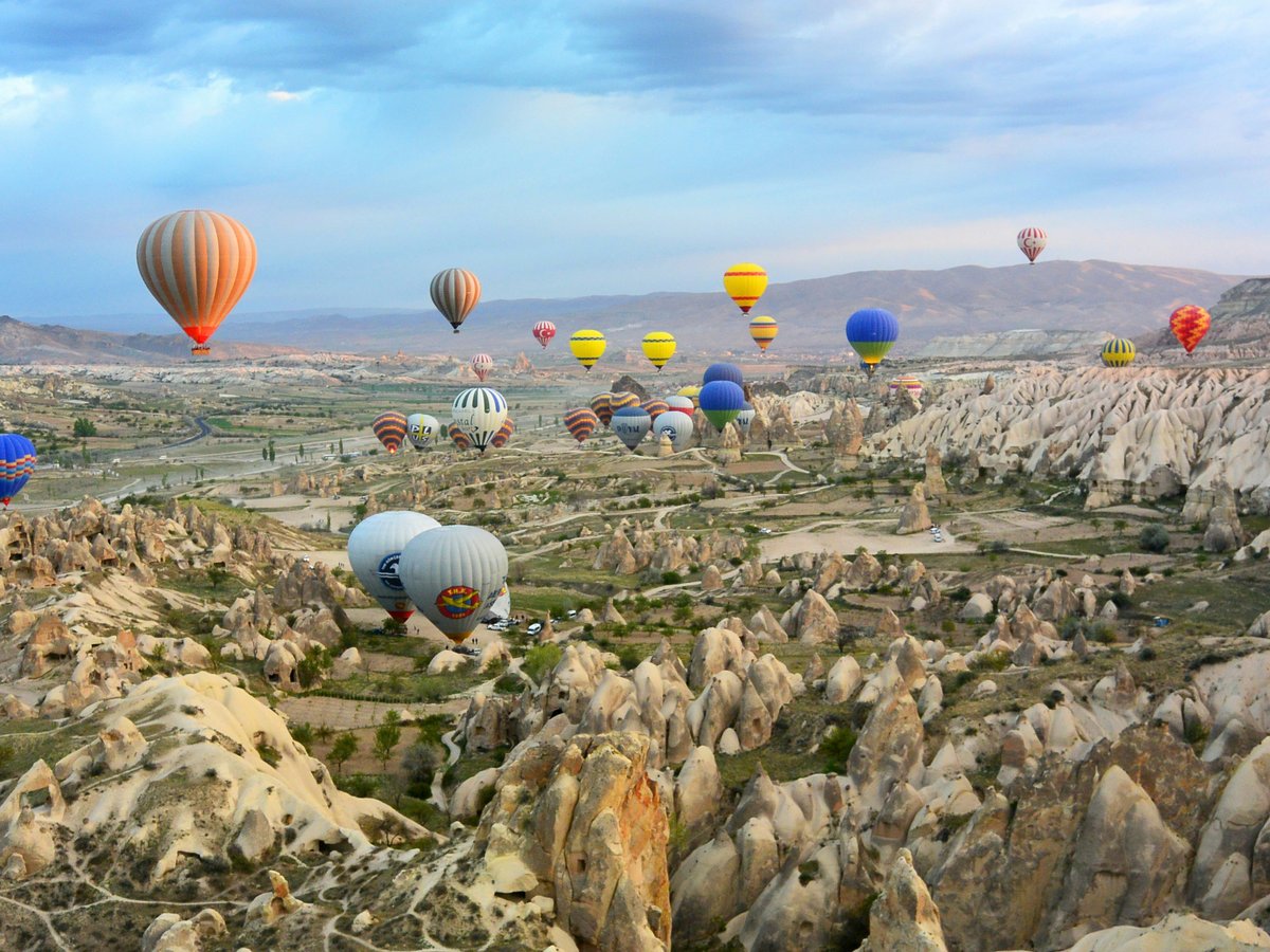 photo of assorted-color air balloon lot in mid air during daytime
