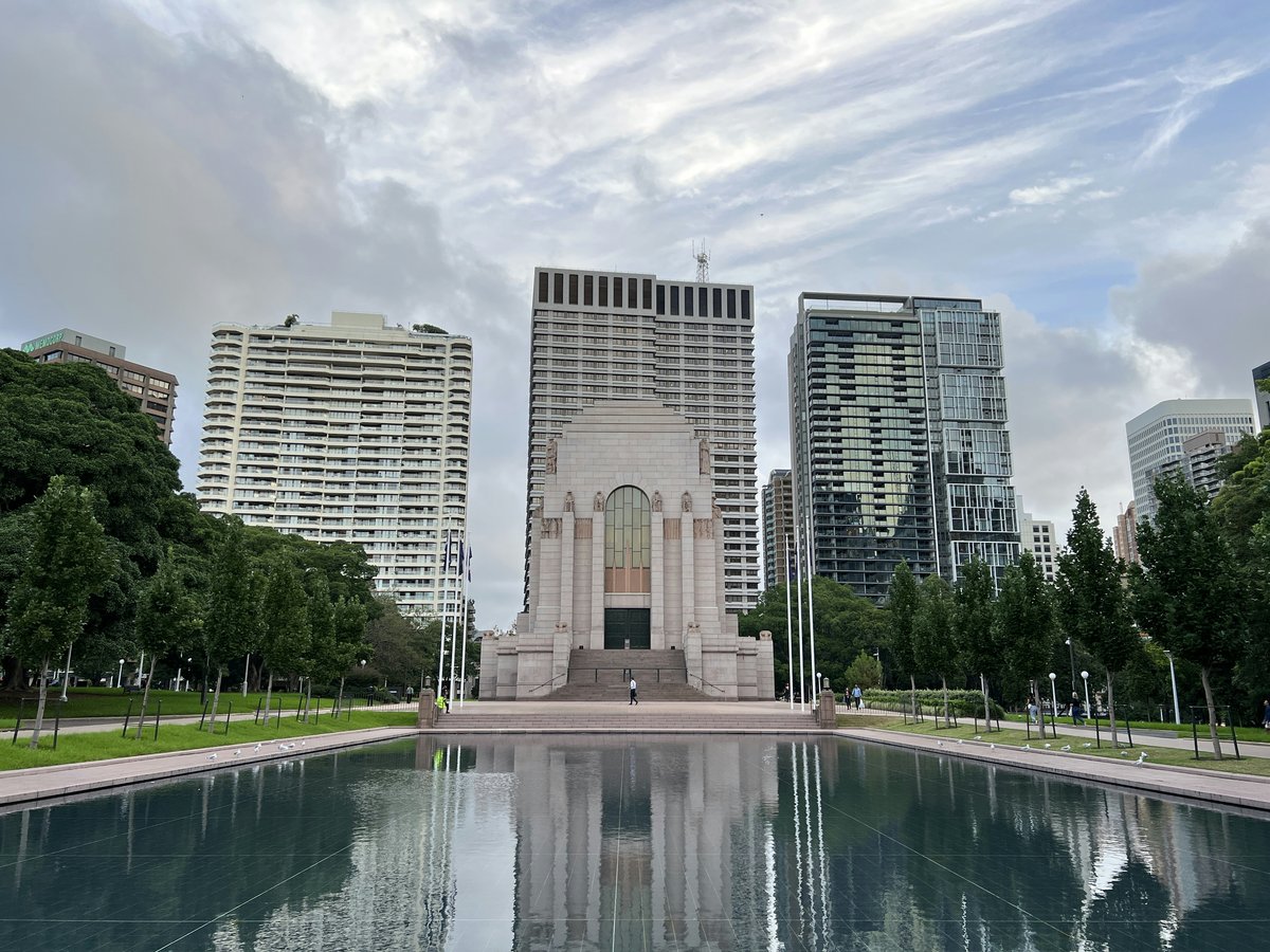 a large building next to a body of water