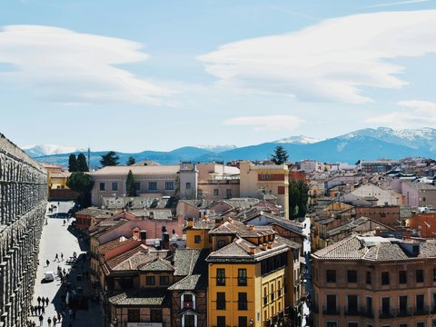 Cityscape with snow-capped mountains in the distance