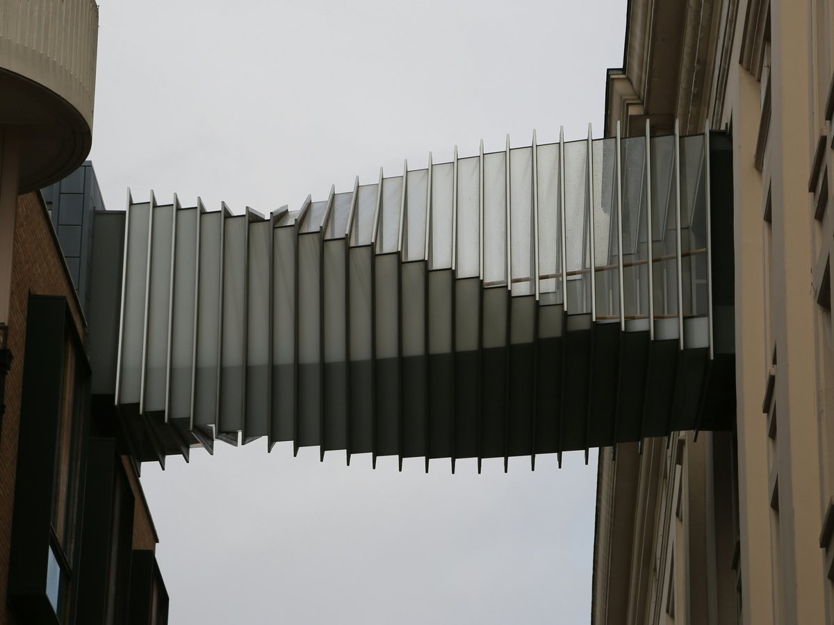 a tall building with a spiral design on the side of it