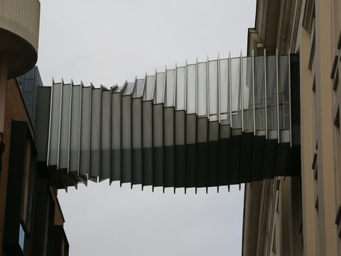 a tall building with a spiral design on the side of it