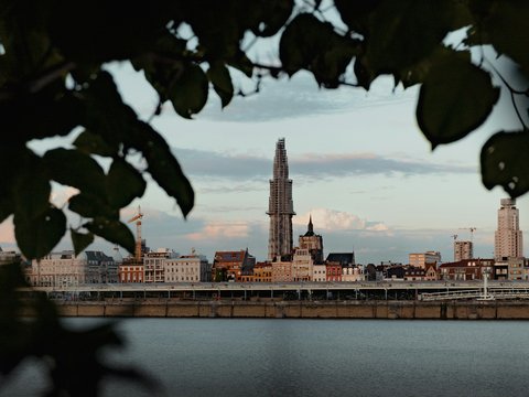 city skyline across body of water during daytime