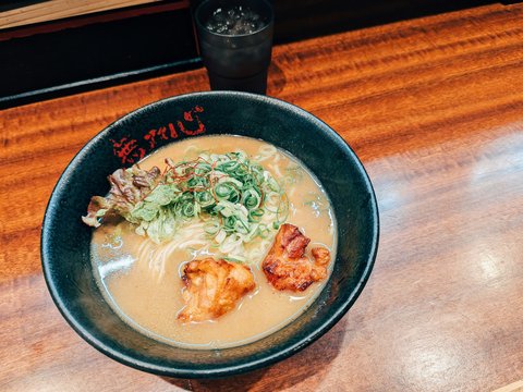 A bowl of soup on a wooden table