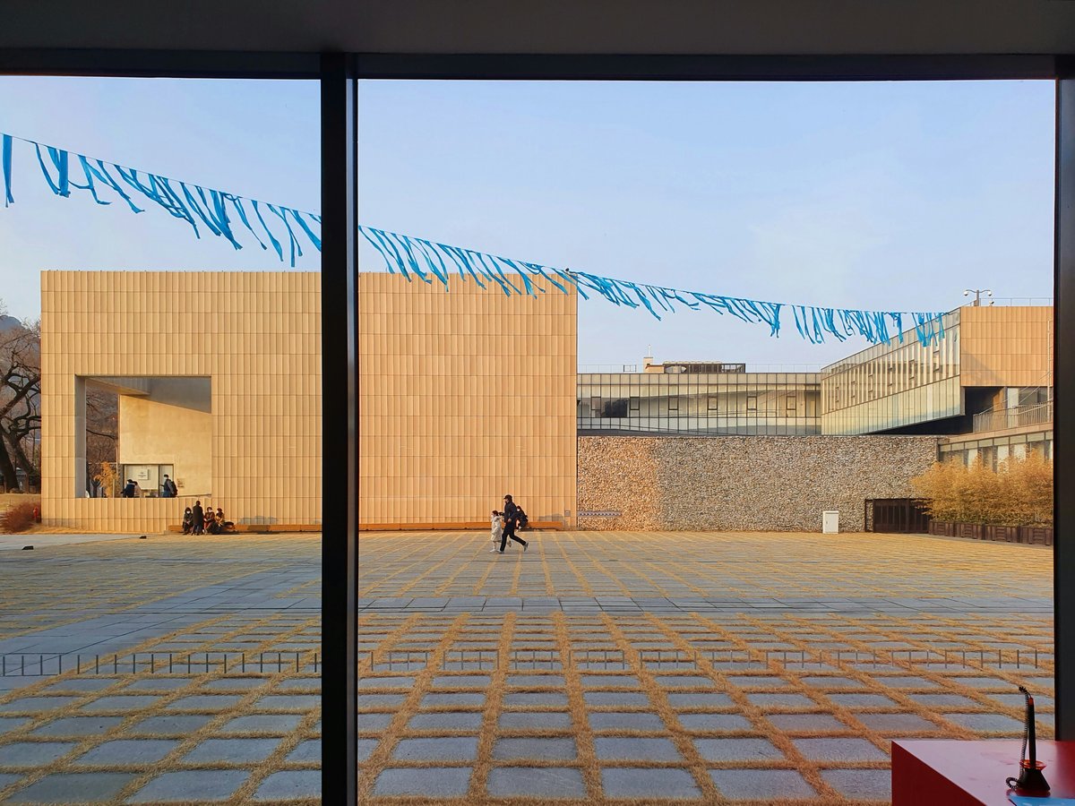 a person walking in front of a building