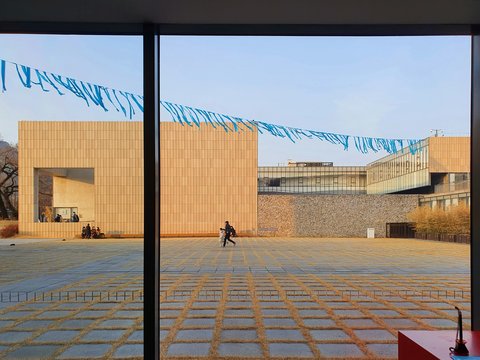 a person walking in front of a building