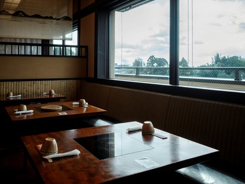 Restaurant tables with view of river and trees